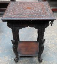 Heavily carved Indonesian style carved square topped side table. Approx. 69cm H x 52cm diameter