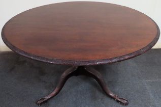 Large early 20th century carved mahogany circular tilt top breakfast table on tripod supports.