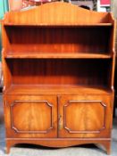 20th century mahogany open bookcase, with two door to bottom. Approx. 112 x 83 x 27cms reasonable
