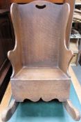 Childs antique oak rocking chair. Approximately. 58cm H x 34cm W Used condition, scuffs and