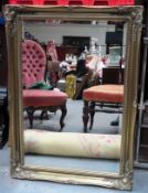 20th century gilt framed bevelled wall mirror. App. 107 x 76cm Reasonable used condition