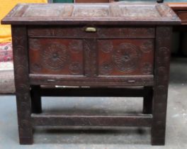 19th century carved and panelled Oak blanket chest with drop front and lift up top. Approx. 84cm H x