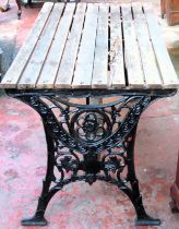 Victorian cast iron slatted garden table. Approx. 65 x 122 x 65cms used with wear damage etc will