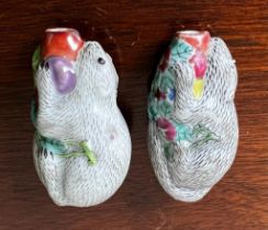 TWO 19th CENTURY CERAMIC SNUFF BOTTLES IN THE FORM OF ORIENTAL SQUIRRELS, APPROX 7.5cm HIGH