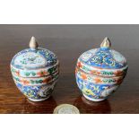 PAIR OF MINIATURE CHINESE CERAMIC POTS AND COVERS