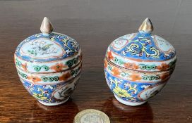 PAIR OF MINIATURE CHINESE CERAMIC POTS AND COVERS