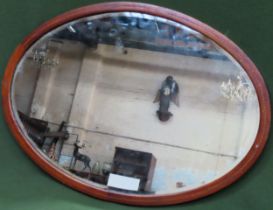 Early 20th century oval mahogany inlaid and bevelled wall mirror. Approx. 62 x 87cms reasonable used