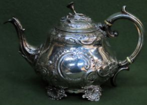 Georgian Hallmarked Silver repousse and relief floral decorated teapot, London assay dated 1797 .