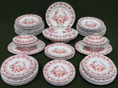 Large quantity of Royal Worcester dinnerware with Delft style floral decoration, dated 1884. Approx.