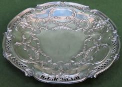 Early 20th century silver plated repousse and piercework decorated shallow dish on raised support.