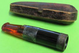 Victorian amber and ebony cheroot holder, with silver coloured mounts, within leather case