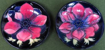 Pair of pretty Moorcroft tube lined floral decorated small circular ceramic receivers. Approx. 12cms