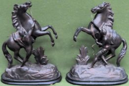 Pair of decorative spelter Marley horses, on ebonised stands. Approx. 45cm H Both in used condition