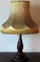 Early 20th century heavily carved mahogany table lamp, with shade. Approx. 52cms H