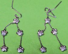 Pair of 18ct white gold diamond set drop earrings, each with 5 double sided flower head clusters