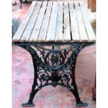 Victorian cast iron slatted garden table. Approx. 65 x 122 x 65cms