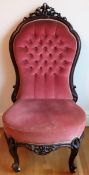 19th century carved mahogany framed and upholstered low button back nursing chair