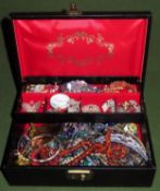 Jewellery case containing various silver and other costume jewellery, strand of amber beads etc