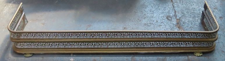 Vintage brass piercework decorated fire kerb. App. 140cm L x 34cm W
