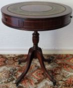 Mahogany three drawer circular drum table, with three drawers and leather insert