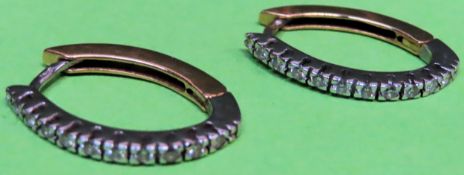 Pair of 18ct (750) hinged hoop earrings, each set with eleven brilliant cut diamonds