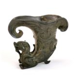 A Chinese archaic form bronze libation cup decorated with a dragon, H. 9.5cm.