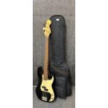 A Squire E Bass guitar with padded case.