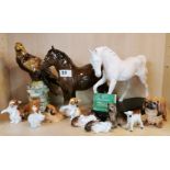 A collection of thirteen Royal Doulton porcelain animal figures, eagle H. 24cm.