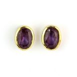 A pair of 9ct earrings set with oval cut amethyst, L. 6cm.