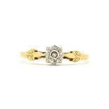 An antique 18ct yellow and white gold solitaire ring set with a brilliant cut diamond, ring size L.