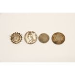 A group of four mixed silver coins and mounted coins.