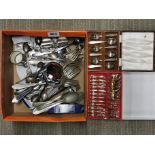 A box of mixed cutlery.