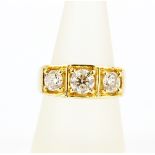 A gent's heavy 9ct yellow gold (stamped 9K) ring set with three large brilliant cut diamonds,