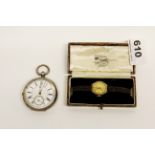 A 1935 silver cased pocketwatch and a yellow metal cased ladies wristwatch.