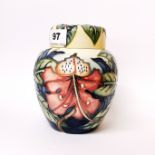 A 2000 Moorcroft tube lined porclain ginger jar decorated with flowers, H. 15cm.