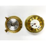 A ships style brass wall clock and a porthole style barometer without glass, Dia. 22cm.