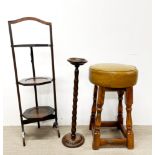 A stained oak and mustard bar stool with a three-tier folding cake stand and an oak smokers stand,