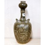 A Chinese Yuan style olive green glazed scraffito decorated pottery vase, decorated with a dragon,
