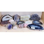 A collection of various semi precious stone geodes, including amethyst, agate, and lemon quartz etc,