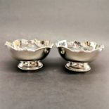 A pair of decorative silver bowls, stamped silver and tested.