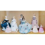 A group of five Coalport and three Royal Doulton porcelain lady figurines, tallest H. 23cm.