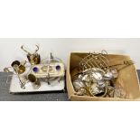 A large box of silver plated and brass items.