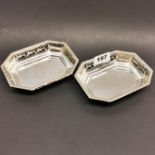 A pair of pierced silver dishes, 14 x 10.5 x 3cm, stamped 925 and tested.