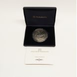 A 2002 boxed 5oz St George silver medallion.