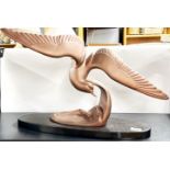 An original Art Deco cast metal and marble figure of a seagull, W. 63cm.