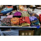 A large collection of Indian Sarees and associated clothing.