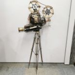 A handmade mixed metal sculpture of an early cine camera, H. 94cm.