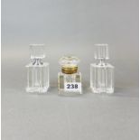 A brass mounted cut glass inkwell and two perfume bottles, tallest H. 11cm.