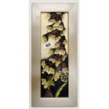 A 2013 framed Moorcroft tube lined, porclain plaque in 'Fairies Foxglove' pattern, frame size 35 x