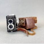 A leather cased Recohmatic twin lens 225 camera.